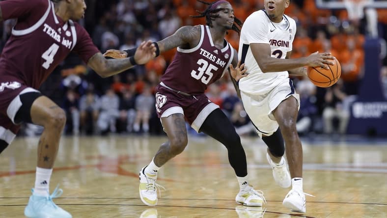 Nov 29, 2023; Charlottesville, Virginia, USA; Virginia Cavaliers guard Reece Beekman (2) drives to the basket past Texas A&M Aggies guard Manny Obaseki (35) in the second half at John Paul Jones Arena. Mandatory Credit: Geoff Burke-USA TODAY Sports