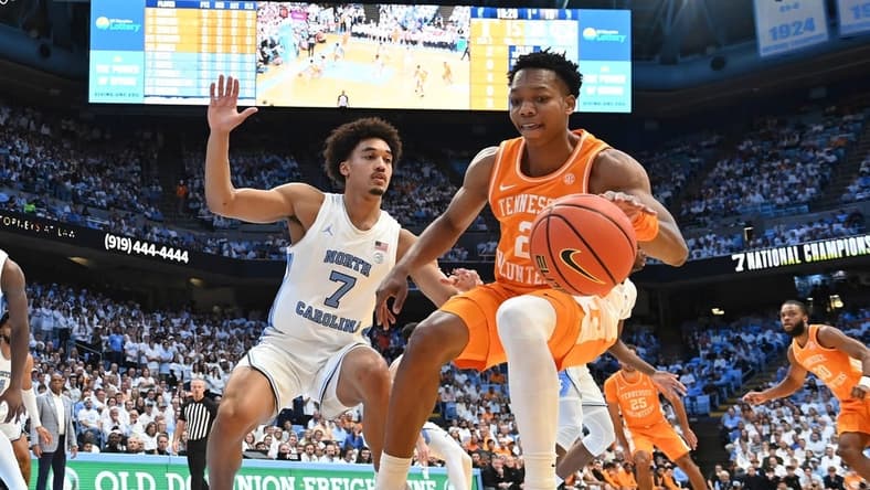 Nov 29, 2023; Chapel Hill, North Carolina, USA; Tennessee Volunteers guard Jordan Gainey (2) dribbles as North Carolina Tar Heels guard Seth Trimble (7) defends in the first half at Dean E. Smith Center. Mandatory Credit: Bob Donnan-USA TODAY Sports