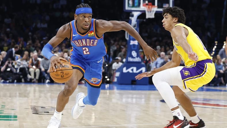 Nov 30, 2023; Oklahoma City, Oklahoma, USA; Oklahoma City Thunder guard Shai Gilgeous-Alexander (2) drives around Los Angeles Lakers guard Max Christie (10) during the second half at Paycom Center. Mandatory Credit: Alonzo Adams-USA TODAY Sports