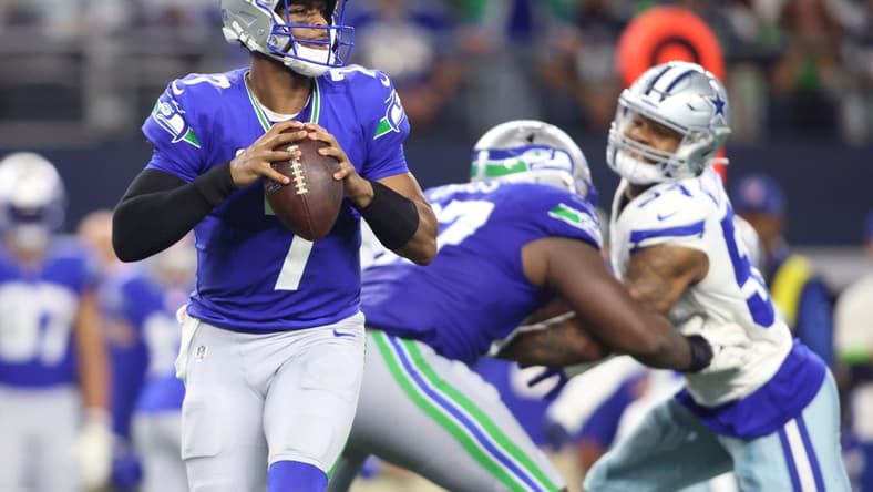Nov 30, 2023; Arlington, Texas, USA; Seattle Seahawks quarterback Geno Smith (7) looks to pass against the Dallas Cowboys during the second half at AT&T Stadium. Mandatory Credit: Tim Heitman-USA TODAY Sports