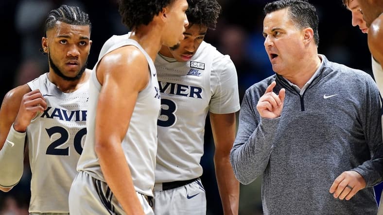 Xavier Musketeers head coach Sean Miller talks with the team during a timeout in the first half of an NCAA college basketball game between the Houston Cougars and the Xavier Musketeers, Friday, Dec. 1, 2023, at Cintas Center in Cincinnati.