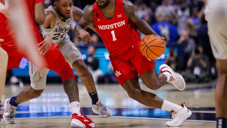 Dec 1, 2023; Cincinnati, Ohio, USA; Houston Cougars guard Jamal Shead (1) dribbles against Xavier Musketeers guard Dayvion McKnight (20) in the first half at Cintas Center. Mandatory Credit: Katie Stratman-USA TODAY Sports