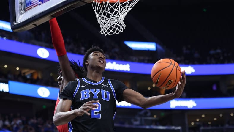 Dec 1, 2023; Salt Lake City, Utah, USA; Brigham Young Cougars guard Jaxson Robinson (2) lays the ball up against the Fresno State Bulldogs during the first half at Delta Center. Mandatory Credit: Rob Gray-USA TODAY Sports