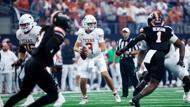 Dec 2, 2023; Arlington, TX, USA; Texas Longhorns quarterback Quinn Ewers (3) looks to throw during the first quarter against the Oklahoma State Cowboys at AT&T Stadium. Mandatory Credit: Kevin Jairaj-USA TODAY Sports