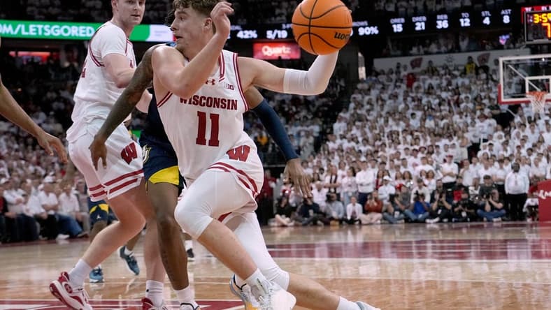 Dec 2, 2023; Madison, Wisconsin, USA; Wisconsin Badgers guard Max Klesmit (11) drives to the basket against the against Marquette Golden Eagles during the second half at the Kohl Center. Wisconsin won 75-64. Mandatory Credit: Mark Hoffman/Milwaukee Journal Sentinel via USA TODAY NETWORK