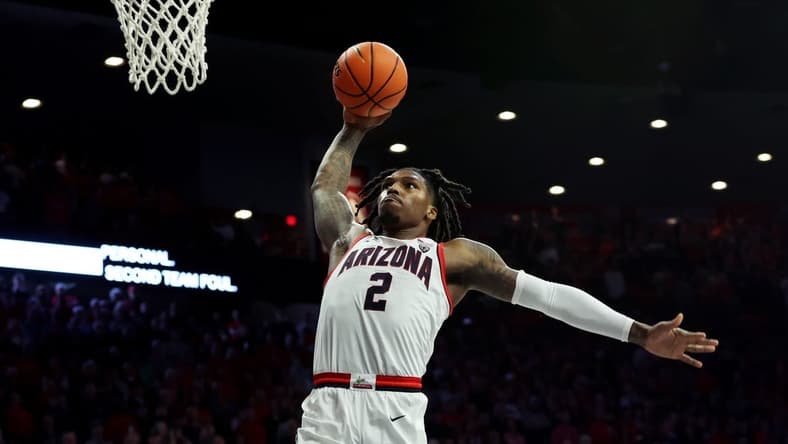 Dec 2, 2023; Tucson, Arizona, USA; Arizona Wildcats guard Caleb Love (2) dunks the ball against the Colgate Raiders during the second half at McKale Center. Mandatory Credit: Zachary BonDurant-USA TODAY Sports