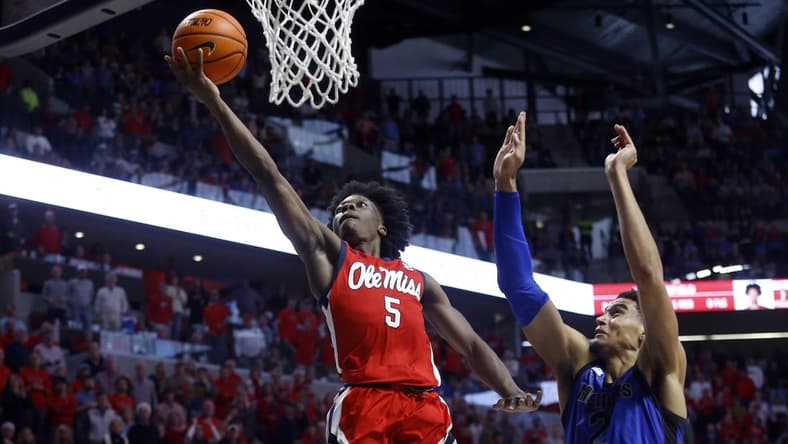 Dec 2, 2023; Oxford, Mississippi, USA; Mississippi Rebels guard Jaylen Murray (5) drives to the basket against Memphis Tigers forward Nicholas Jourdain (2) during the second half at The Sandy and John Black Pavilion at Ole Miss. Mandatory Credit: Petre Thomas-USA TODAY Sports