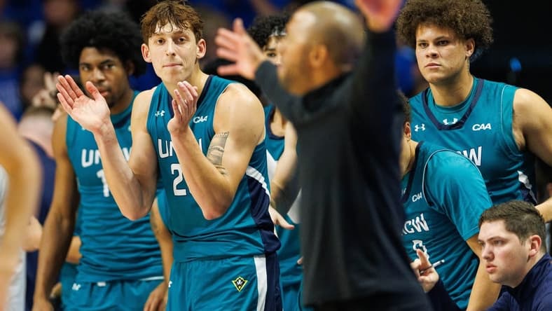 Dec 2, 2023; Lexington, Kentucky, USA; North Carolina-Wilmington Seahawks forward Eric Van Der Heijden (23) celebrates from the bench during the second half against the Kentucky Wildcats at Rupp Arena at Central Bank Center. Mandatory Credit: Jordan Prather-USA TODAY Sports