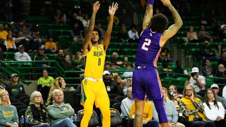 Dec 2, 2023; Waco, Texas, USA; Baylor Bears forward Jalen Bridges (11) scores a three point basket against Northwestern State Demons guard Jamison Epps (2) during the first half at Ferrell Center. Mandatory Credit: Chris Jones-USA TODAY Sports
