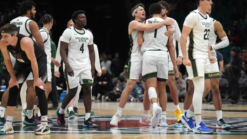 Dec 2, 2023; Las Vegas, Nevada, USA; Colorado State Rams guard Isaiah Stevens (4), forward Joel Scott (1) and guard Cam Lowe (22) celebrate after the Legends of Basketball Las Vegas Invitational game against the Washington Huskies at MGM Grand Garden Arena. Mandatory Credit: Kirby Lee-USA TODAY Sports