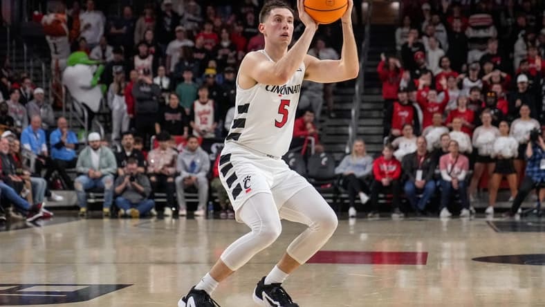 Cincinnati Bearcats guard CJ Fredrick (5) shoots a wide open three pointer in the first half of the NCAA men   s basketball game between the Cincinnati Bearcats and the Florida Gulf Coast Eagles at Fifth Third Arena in Cincinnati on Sunday, Dec. 3, 2023.