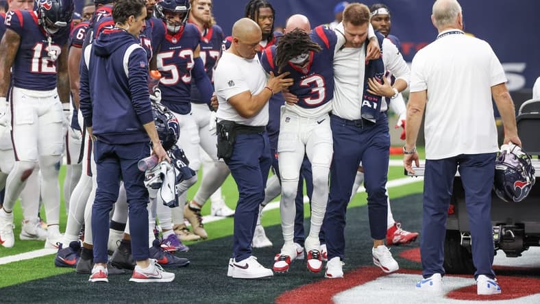 Dec 3, 2023; Houston, Texas, USA; Trainers move an injured Houston Texans wide receiver Tank Dell (3) two the cart as he injured himself on a touchdown play against the Denver Broncos at NRG Stadium. Mandatory Credit: Thomas Shea-USA TODAY Sports