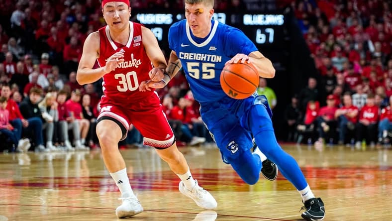 Dec 3, 2023; Lincoln, Nebraska, USA; Creighton Bluejays guard Baylor Scheierman (55) drives against Nebraska Cornhuskers guard Keisei Tominaga (30) during the second half at Pinnacle Bank Arena. Mandatory Credit: Dylan Widger-USA TODAY Sports