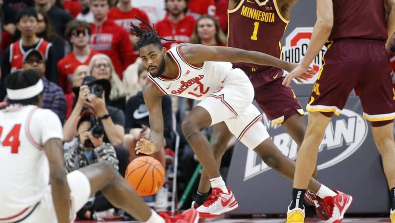 Dec 3, 2023; Columbus, Ohio, USA;  Ohio State Buckeyes guard Evan Mahaffey (12) reaches for the loose ball during the first half against the Minnesota Golden Gophers at Value City Arena. Mandatory Credit: Joseph Maiorana-USA TODAY Sports