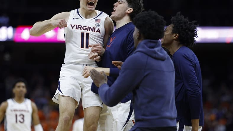 Dec 5, 2023; Charlottesville, Virginia, USA; Virginia Cavaliers guard Isaac McKneely (11) celebrates with teammates against the North Carolina Central Eagles in the first half at John Paul Jones Arena. Mandatory Credit: Geoff Burke-USA TODAY Sports
