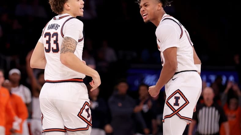 Illinois Fighting Illini forward Coleman Hawkins (33) celebrates his three point shot against the Florida Atlantic Owls with guard Terrence Shannon Jr. (0) during the second half at Madison Square Garden. Mandatory Credit: Brad Penner-USA TODAY Sports
