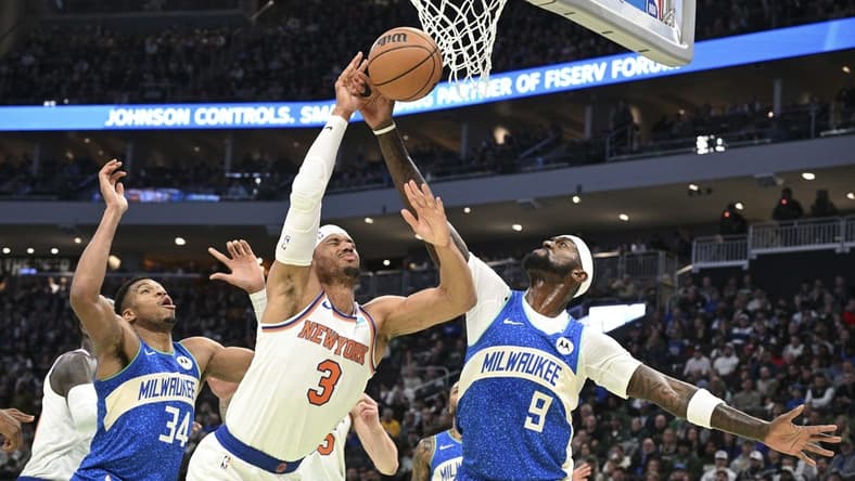 Dec 5, 2023; Milwaukee, Wisconsin, USA; New York Knicks guard Josh Hart (3) and Milwaukee Bucks forward Bobby Portis (9) battle for a rebound in the first half at Fiserv Forum. Mandatory Credit: Michael McLoone-USA TODAY Sports