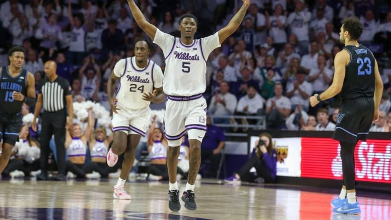 Dec 5, 2023; Manhattan, Kansas, USA; Kansas State Wildcats guard Cam Carter (5) celebrates a three-point basket during the second half against the Villanova Wildcats at Bramlage Coliseum. Mandatory Credit: Scott Sewell-USA TODAY Sports