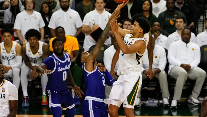 Dec 5, 2023; Waco, Texas, USA; Baylor Bears guard RayJ Dennis (10) shoots and is fouled by Seton Hall Pirates guard Al-Amir Dawes (2) during the second half at Ferrell Center. Mandatory Credit: Chris Jones-USA TODAY Sports