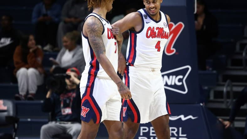 Dec 5, 2023; Oxford, Mississippi, USA; Mississippi Rebels forward Jaemyn Brakefield (4) and Mississippi Rebels guard Allen Flanigan (7) talk during the second half against the Mount St. Mary's Mountaineers at The Sandy and John Black Pavilion at Ole Miss. Mandatory Credit: Petre Thomas-USA TODAY Sports