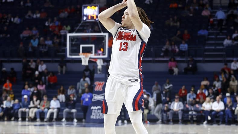 Dec 5, 2023; Oxford, Mississippi, USA; Mississippi Rebels guard Robert Cowherd (13) shoots for three during the first half at The Sandy and John Black Pavilion at Ole Miss. Mandatory Credit: Petre Thomas-USA TODAY Sports