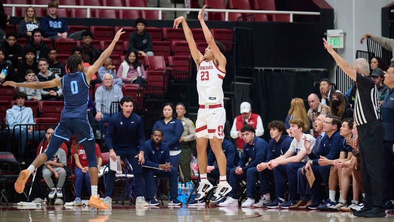 Dec 3, 2023; Stanford, California, USA; Stanford Cardinal forward Brandon Angel (23) shoots the ball against San Diego Toreros guard Kevin Patton Jr. (0) during the first half at Maples Pavilion. Mandatory Credit: Robert Edwards-USA TODAY Sports