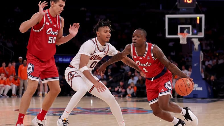 Dec 5, 2023; New York, New York, USA; Florida Atlantic Owls guard Johnell Davis (1) drives to the basket against Illinois Fighting Illini guard Terrence Shannon Jr. (0) in front of Owls center Vladislav Goldin (50) during the second half at Madison Square Garden. Mandatory Credit: Brad Penner-USA TODAY Sports