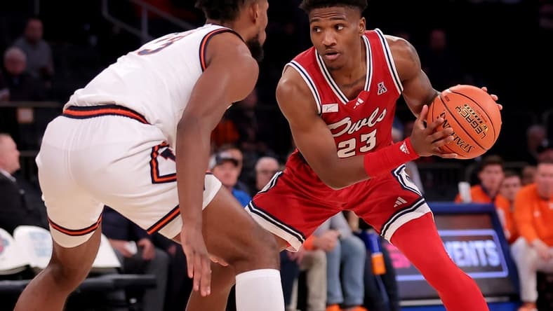 Dec 5, 2023; New York, New York, USA; Florida Atlantic Owls guard Brandon Weatherspoon (23) controls the ball against Illinois Fighting Illini forward Quincy Guerrier (13) during the second half at Madison Square Garden. Mandatory Credit: Brad Penner-USA TODAY Sports