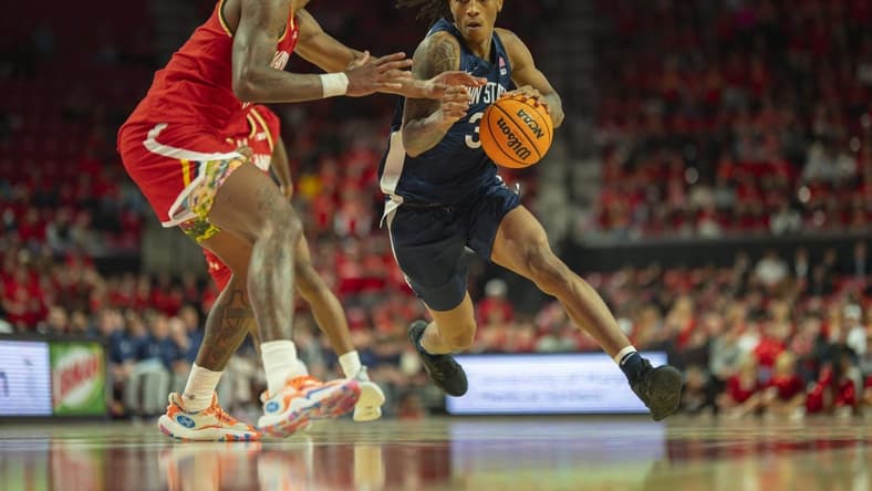 Dec 6, 2023; College Park, Maryland, USA; Penn State Nittany Lions guard Nick Kern Jr. (3) dribble by Maryland Terrapins forward Julian Reese (10) during the first half at Xfinity Center. Mandatory Credit: Tommy Gilligan-USA TODAY Sports