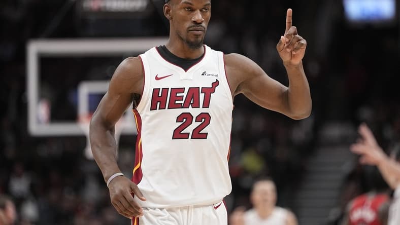 Dec 6, 2023; Toronto, Ontario, CAN; Miami Heat forward Jimmy Butler (22) gestures his bench during the fourth quarter against the Toronto Raptors at Scotiabank Arena. Mandatory Credit: John E. Sokolowski-USA TODAY Sports