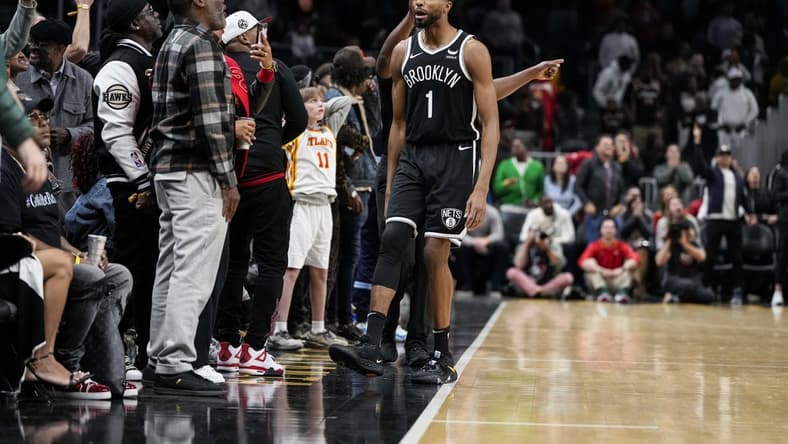 Dec 6, 2023; Atlanta, Georgia, USA; Brooklyn Nets forward Mikal Bridges (1) reacts with the fans after making the eventual game winning basket against the Atlanta Hawks in the final minute during the second half at State Farm Arena. Mandatory Credit: Dale Zanine-USA TODAY Sports