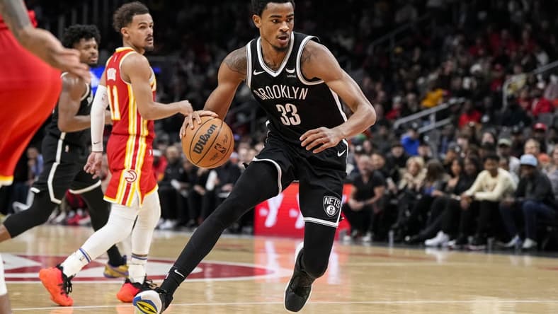 Dec 6, 2023; Atlanta, Georgia, USA; Brooklyn Nets center Nic Claxton (33) controls the ball against the Atlanta Hawks during the second half at State Farm Arena. Mandatory Credit: Dale Zanine-USA TODAY Sports