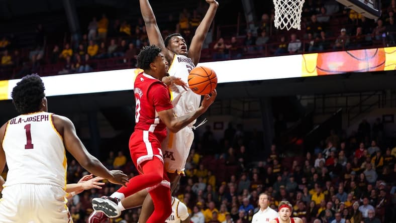 Dec 6, 2023; Minneapolis, Minnesota, USA; Nebraska Cornhuskers guard Jamarques Lawrence (10) drives to the basket as Minnesota Golden Gophers forward Pharrel Payne (21) defends during the second half at Williams Arena. Mandatory Credit: Matt Krohn-USA TODAY Sports
