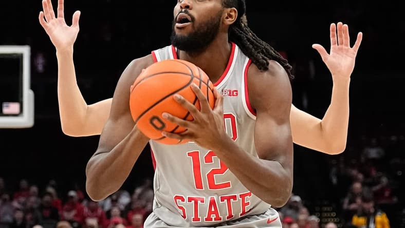 Dec 6, 2023; Columbus, OH, USA; Ohio State Buckeyes guard Evan Mahaffey (12) picks up his dribble in front of a Miami Redhawks defender during the first half of the NCAA men s basketball game at Value City Arena.