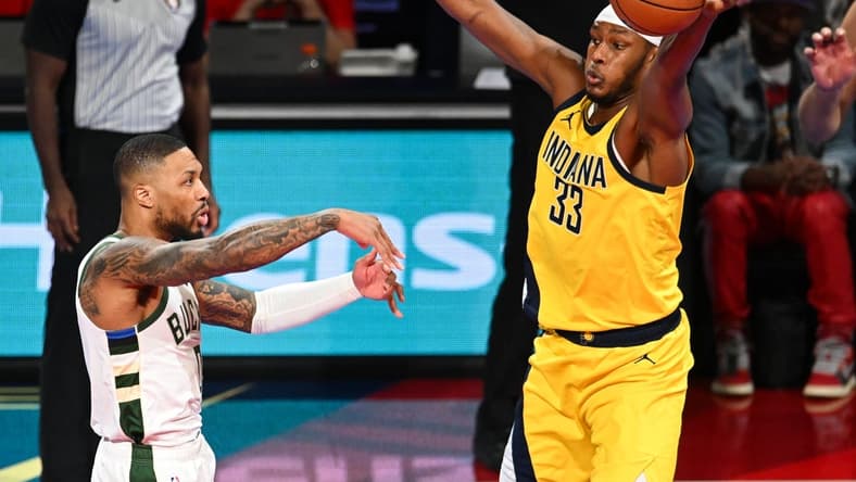 Dec 7, 2023; Las Vegas, Nevada, USA; Indiana Pacers center Myles Turner (33) gets a hand on a pass by Milwaukee Bucks guard Damian Lillard (0) during the first quarter at T-Mobile Arena. Mandatory Credit: Candice Ward-USA TODAY Sports