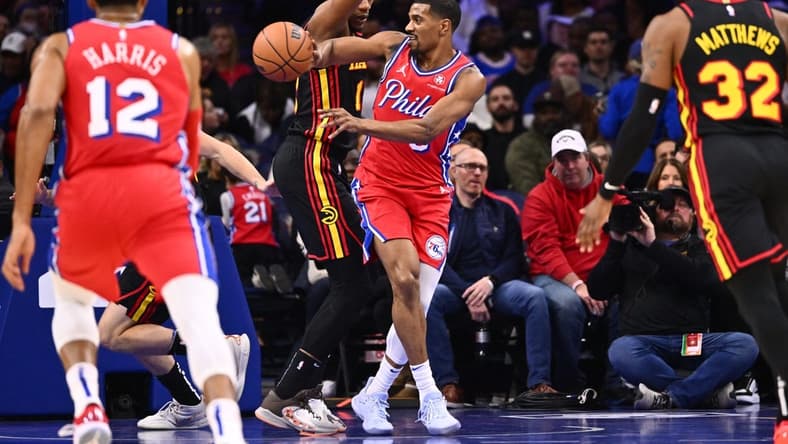 Dec 8, 2023; Philadelphia, Pennsylvania, USA; Philadelphia 76ers guard De'Anthony Melton (8) passes the ball against Atlanta Hawks forward De'Andre Hunter (12) in the first quarter at Wells Fargo Center. Mandatory Credit: Kyle Ross-USA TODAY Sports