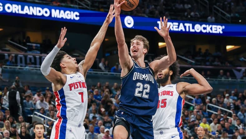 Dec 8, 2023; Orlando, Florida, USA; Orlando Magic forward Franz Wagner (22) goes to the basket against Detroit Pistons guard Killian Hayes (7) during the second quarter at Amway Center. Mandatory Credit: Mike Watters-USA TODAY Sports
