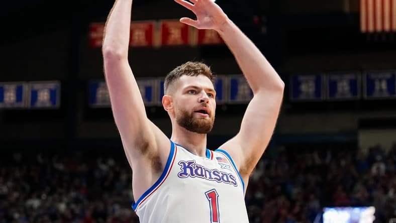 Dec 1, 2023; Lawrence, Kansas, USA; Kansas Jayhawks center Hunter Dickinson (1) celebrates during the first half against the Connecticut Huskies at Allen Fieldhouse. Mandatory Credit: Jay Biggerstaff-USA TODAY Sports