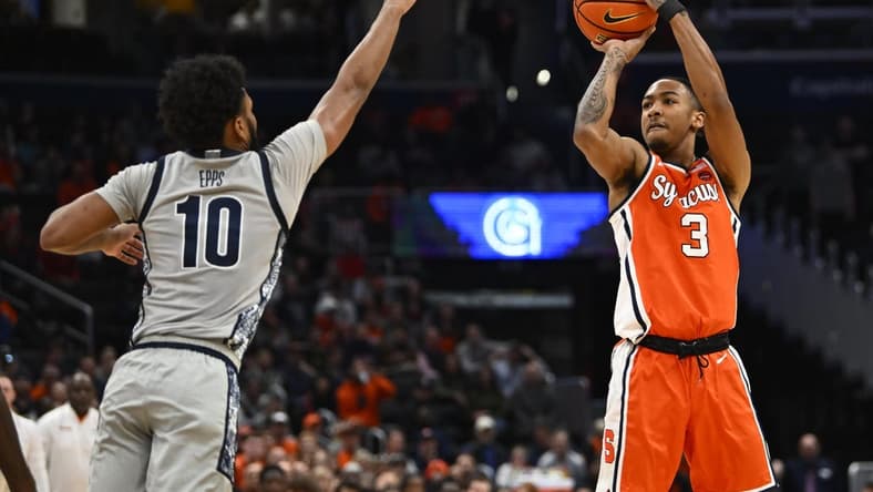 Dec 9, 2023; Washington, District of Columbia, USA; Syracuse Orange guard Judah Mintz (3) shoots over Georgetown Hoyas guard Jayden Epps (10) during the first half at Capital One Arena. Mandatory Credit: Brad Mills-USA TODAY Sports