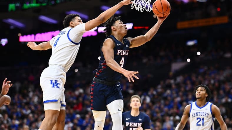 Dec 9, 2023; Philadelphia, Pennsylvania, USA; Penn Quakers guard Tyler Perkins (4) shoots the ball against Kentucky Wildcats forward Tre Mitchell (4) in the first half at Wells Fargo Center. Mandatory Credit: Kyle Ross-USA TODAY Sports