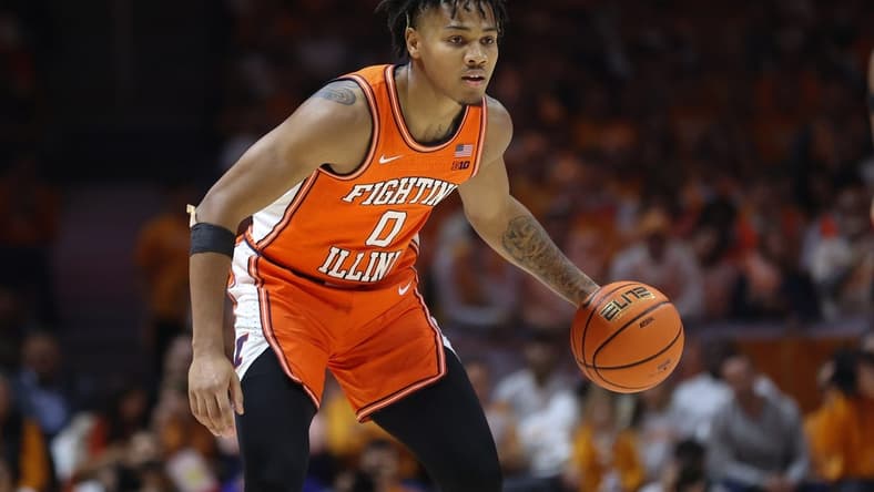 Dec 9, 2023; Knoxville, Tennessee, USA; Illinois Fighting Illini guard Terrence Shannon Jr. (0) brings the ball up court against the Tennessee Volunteers during the first half at Food City Center at Thompson Boling Arena. Mandatory Credit: Randy Sartin-USA TODAY Sports