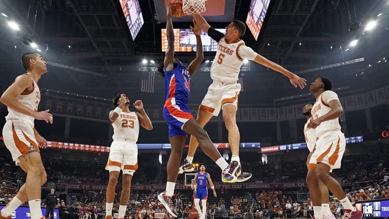Dec 9, 2023; Austin, Texas, USA; Texas Longhorns forward Kadin Shedrick (5) blocks the shot attempted by Houston Christian Huskies forward Michael Imariagbe (33) during the first half at Moody Center. Mandatory Credit: Scott Wachter-USA TODAY Sports