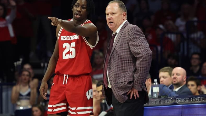 Dec 9, 2023; Tucson, Arizona, USA; Wisconsin Badgers guard John Blackwell (25) talks to Wisconsin Badgers head coach Greg Gard during the second half at McKale Center. Mandatory Credit: Zachary BonDurant-USA TODAY Sports
