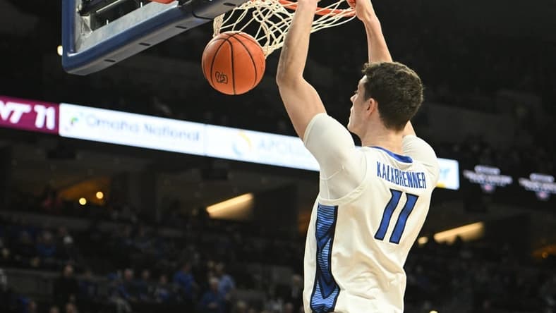 Dec 9, 2023; Omaha, Nebraska, USA; Creighton Bluejays center Ryan Kalkbrenner (11) dunks against the Central Michigan Chippewas in the second half at CHI Health Center Omaha. Mandatory Credit: Steven Branscombe-USA TODAY Sports