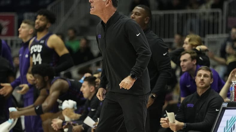 Dec 9, 2023; Toronto, Ontario, CAN; TCU Horned Frogs head coach Jamie Dixon reacts during the first half against the Clemson Tigers at Coca-Cola Coliseum. Mandatory Credit: John E. Sokolowski-USA TODAY Sports