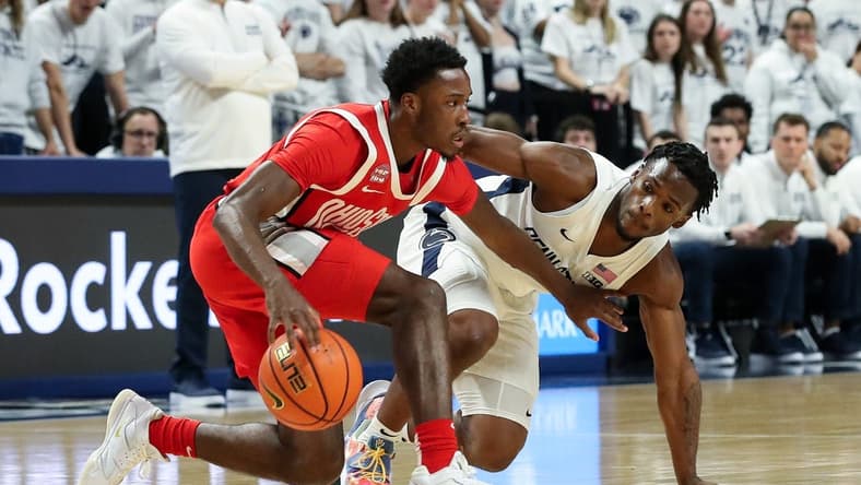 Dec 9, 2023; University Park, Pennsylvania, USA; Ohio State Buckeyes guard Dale Bonner (4) dribbles the ball as Penn State Nittany Lions guard Kanye Clary (0) defends during the first half at Bryce Jordan Center. Mandatory Credit: Matthew O'Haren-USA TODAY Sports