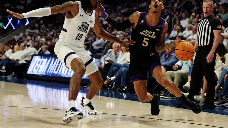 Dec 9, 2023; Norfolk, Virginia, USA; James Madison Dukes guard Terrence Edwards (5) drives to the basket against Old Dominion Monarchs guard Tyrone Williams (10) at Chartway Arena at the Ted Constant Convocation Center. Mandatory Credit: Peter Casey-USA TODAY Sports