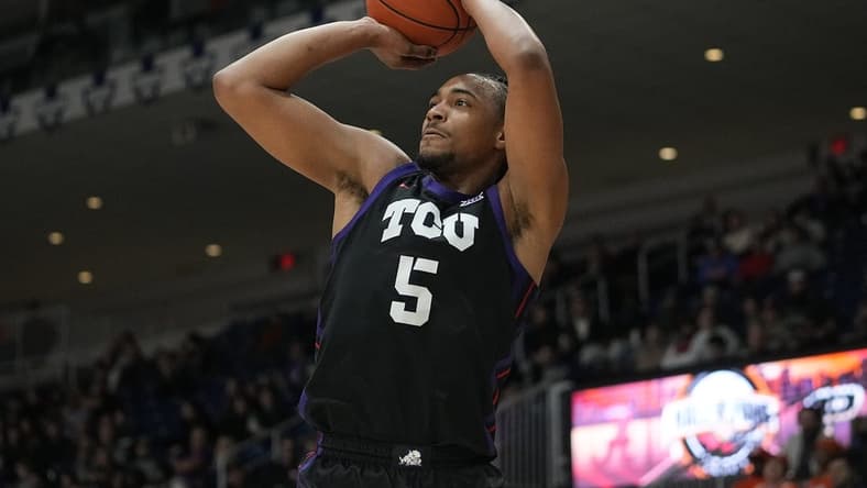 Dec 9, 2023; Toronto, Ontario, CAN; TCU Horned Frogs forward Chuck O'Bannon Jr. (5) goes to shoot a basket against Clemson Tigers during the first half at Coca-Cola Coliseum. Mandatory Credit: John E. Sokolowski-USA TODAY Sports