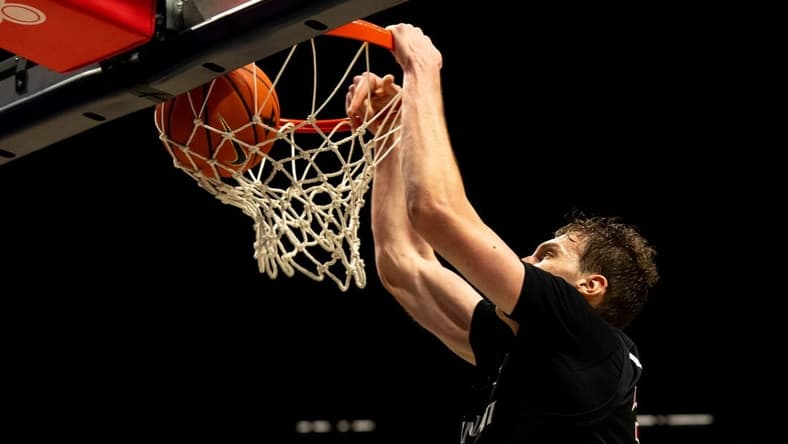 Cincinnati Bearcats forward Viktor Lakhin (30) dunks in the second half of the NCAA Basketball game between the Cincinnati Bearcats and Xavier Musketeers at the Cintas Center in Cincinnati on Saturday, Dec. 9, 2023.