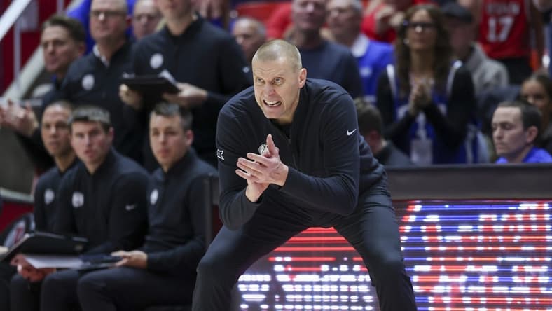 Dec 9, 2023; Salt Lake City, Utah, USA; Brigham Young Cougars head coach Mark Pope encourages the team against the Utah Utes during the second half at Jon M. Huntsman Center. Mandatory Credit: Rob Gray-USA TODAY Sports